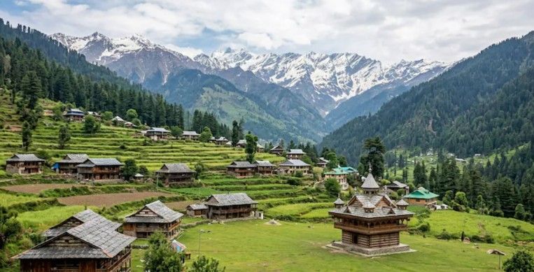 Green terraced village with a wooden temple and snow peaks